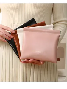 Set of four colorful PU leather pouches for coins and sanitary pads