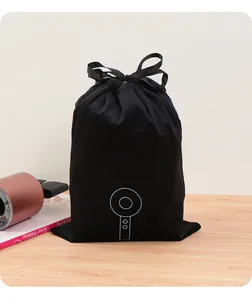 Pochette de rangement en velours noir de qualité avec icône de sèche-cheveux épurée