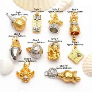 Detailed macro shot of ten antique gold Buddhist mantra charms with model numbers and dimensions