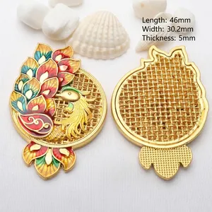 Detail view of ancient gold hollow peacock pendant with intricate colorful enamel work