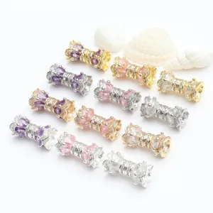 Detailed macro view of gold and silver micro-pave zircon rotating screw clasps for DIY
