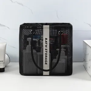 Portable black mesh shower storage bag for toiletries with white decorative strap