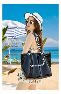 Black glossy waterproof beach bag for swimming and gym, perfect for beach vacations.
