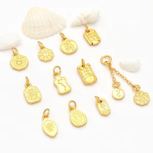 Detailed view of various golden Taoist pendants with Bagua and Yin Yang motifs