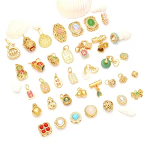 Collection of traditional Chinese style gold DIY jewelry pendants with gourd and prayer symbols