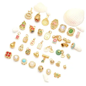 Detailed array of Chinese style gold-plated jewelry pendants with traditional charms