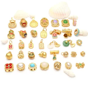 Detailed view of various traditional Chinese sand gold pendants and DIY charms with shells