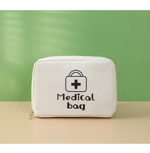 Pochette de premiers secours compacte en tissu crème avec imprimé Medical Bag et zip