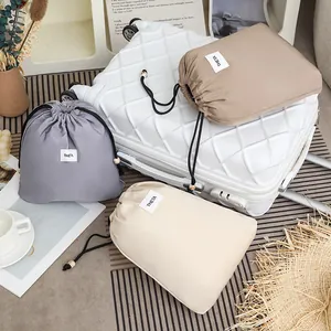 Set of 3 waterproof drawstring storage bags for travel in grey beige and khaki