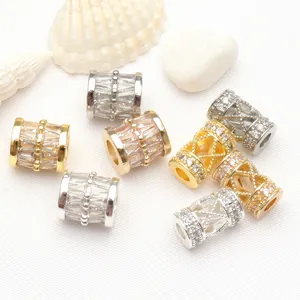 Detailed view of 14K gold plated micro-pave CZ barrel and cylinder spacer beads for DIY jewelry