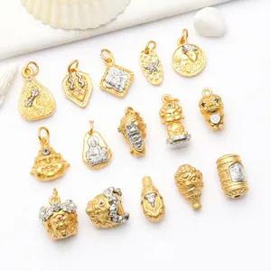 Selection of ancient sand gold Buddhist charms and beads for DIY jewelry making