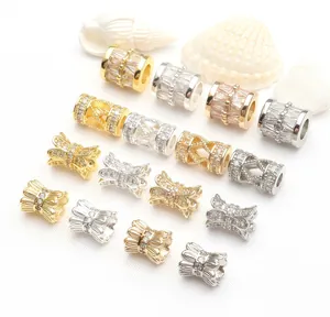Close-up of 14K gold-plated micro-pave zirconia beads in various shapes and colors