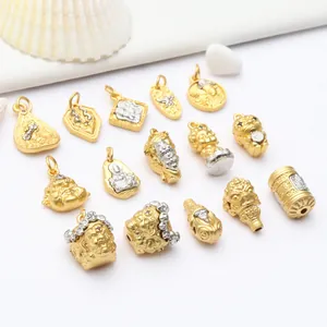 High quality detailed view of antique gold Buddhist charms and DIY jewelry accessories