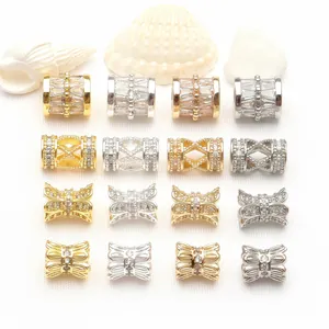 Collection of 14K gold plated cubic zirconia spacer beads and bow charms for jewelry DIY