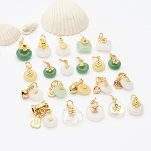 Assortment of antique gold and chalcedony pendants with traditional Chinese charms