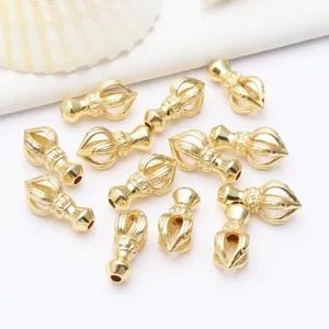 Foto detallada de dijes Vajra chapados en oro para hacer joyas budistas DIY ahora