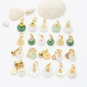 Detail of chalcedony Ping An Kou pendants with gold-plated bell and flower accents for jewelry DIY.