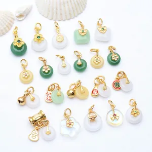 Detailed view of ancient gold-plated chalcedony pendants and bell charms for DIY jewelry