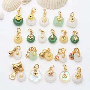 Detailed view of antique gold chalcedony pendants with traditional Chinese motifs