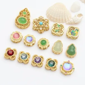 Detailed macro view of assorted colorful stone inlaid gold jewelry beads for DIY bracelets