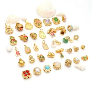Detailed view of various ancient gold-style Chinese lucky pendants for DIY jewelry