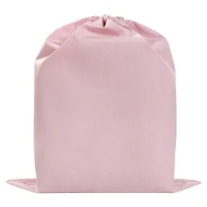 Light pink waterproof drawstring travel storage bag for clothing and shoe organization