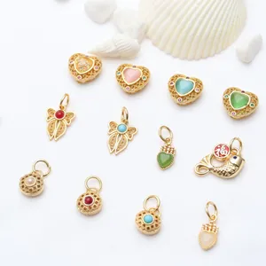 Collection of various gold-plated enamel charms and pendants for DIY jewelry making accessories