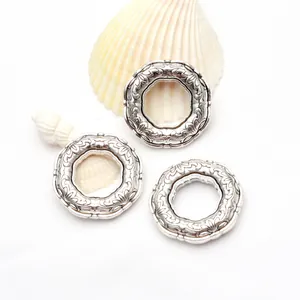 Close-up of vintage Tibetan silver rings with intricate carved patterns for jewelry DIY