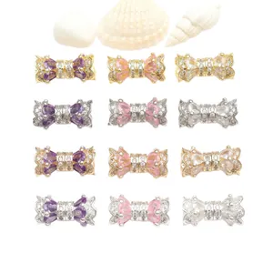Elegant bow-shaped copper clasps with micro-inlaid zircons for DIY jewelry making.
