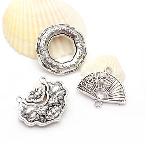 Detailed antique silver flower fan and goldfish pendants for DIY vintage jewelry making