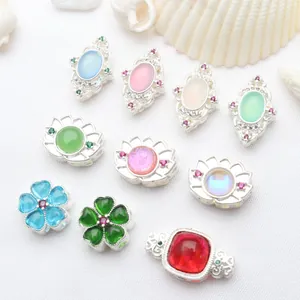 Detailed view of colorful stone-set silver-plated hollow beads for DIY jewelry