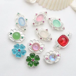 Macro view showing various silver-plated DIY jewelry beads with colorful gemstones
