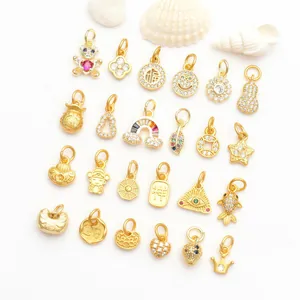 Detailed collection of gold DIY jewelry charms with micro-set zircon and traditional symbols