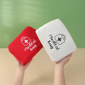 Trousses de premiers soins portables en tissu rouge et blanc pour ranger les médicaments
