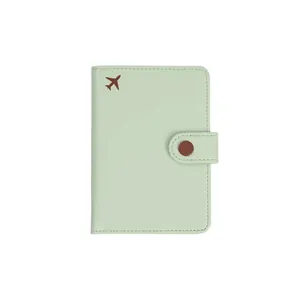 Elegant mint green PU leather RFID passport holder with small airplane icon detail