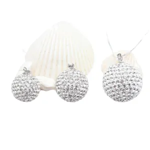 Close-up of S925 silver spherical pendants fully studded with brilliant white crystals