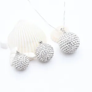 Detailed shot of sparkling S925 silver rhinestone ball pendants with decorative sea shells