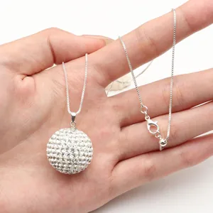 Detailed view of an S925 silver necklace with a sparkling rhinestone-encrusted ball pendant