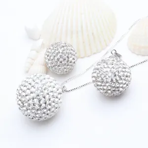 Detailed macro shot of an S925 silver necklace featuring a sparkling rhinestone ball pendant.