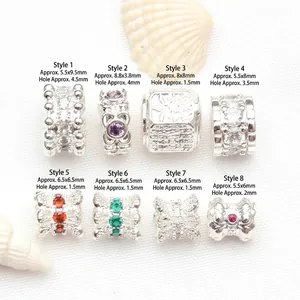 Detail view of silver-plated spacer beads with multi-color CZ micro-pave inlays.