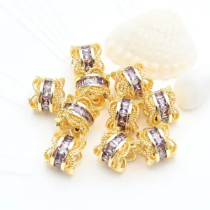 Macro detail of 14K gold plated micro-pave purple zircon waist spacer beads for DIY jewelry