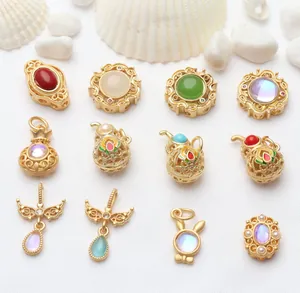 Collection of ancient gold style jewelry charms with colorful enamel and stone inlays