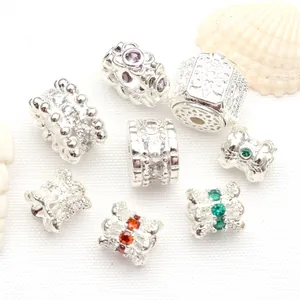 Detailed view of silver-plated micro-set CZ spacer beads for DIY jewelry making.