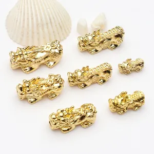 Detailed view of 18k gold plated Pixiu beads for DIY jewelry making and bracelets