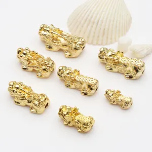 Detailed view of assorted Pixiu lucky charms in various sizes with intricate engravings