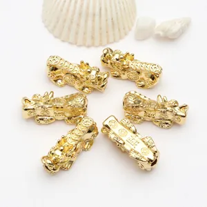 Detailed view of 18k gold plated Pixiu beads for DIY jewelry making with fortune engravings