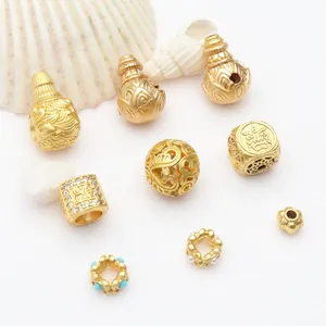 Macro view of ancient gold style hollow gourd and micro-pave spacer beads for DIY jewelry