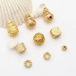 Collection of antique sand gold DIY jewelry beads with gourd charms and hollow spacers