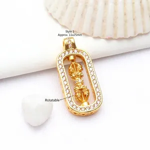 Detail of rotating ancient gold vajra scepter pendant with sparkling zircon inlay