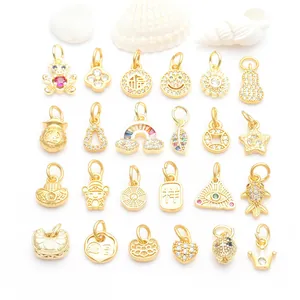 Detailed macro view of 24 assorted ancient gold charms with micro-paved zircons